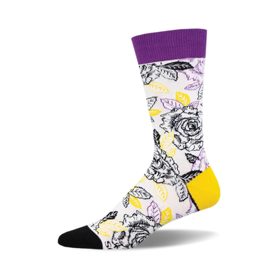 socks with a pattern of black and white roses with yellow centers and green leaves on a white background. the top of the sock is purple and the toe and heel are black.