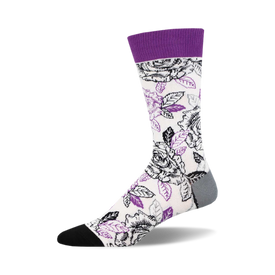 socks that are white with a pattern of black and purple roses. the roses have black stems and green leaves. socks with a purple top and a black toe and heel.