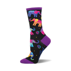 Black crew socks with colorful, patterned elephants and purple cuffs. Fun and vibrant design.
