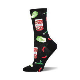 socks that are black and have a pattern of kimchi, a korean side dish made of fermented vegetables. the kimchi is depicted in jars and surrounded by red chili peppers, green onions, and napa cabbage.