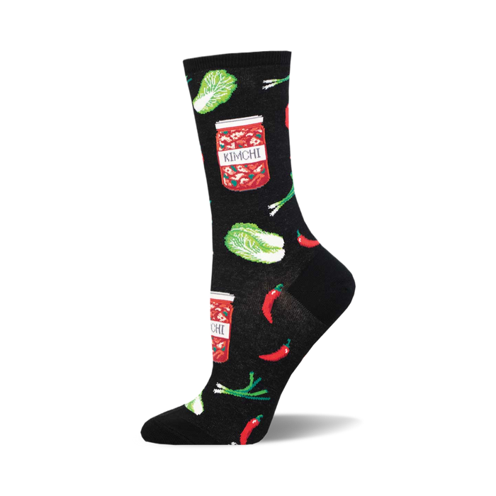 socks that are black and have a pattern of kimchi, a korean side dish made of fermented vegetables. the kimchi is depicted in jars and surrounded by red chili peppers, green onions, and napa cabbage. }}