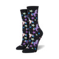 A pair of crew socks in black with pastel unicorns and stars.  Fun, whimsical design.