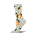 A pair of light green crew socks adorned with a repeating pattern of ripe peaches, green leaves, and delicate white flowers.