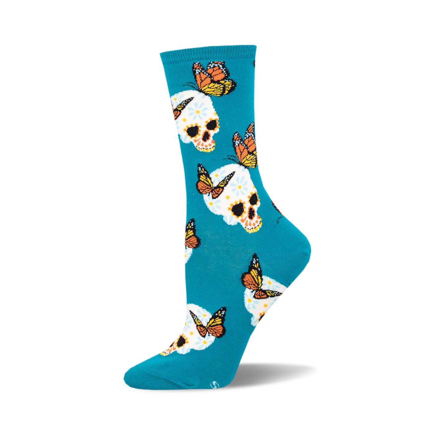 Teal crew socks featuring a whimsical pattern of sugar skulls decorated with flowers and monarch butterflies.