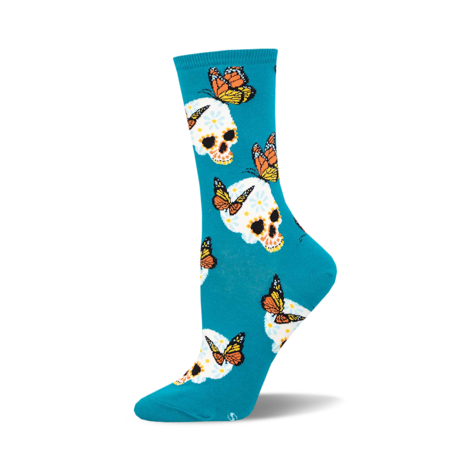 Teal crew socks featuring a whimsical pattern of sugar skulls decorated with flowers and monarch butterflies.
