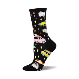 socks that are black with a pattern of colorful street food vendors. there are ice cream trucks, hot dog stands, and pretzel carts. the background is filled with small white dots.