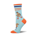 Crew socks in light blue featuring roller-skating sloths and the phrase 'Comin' In Hot.' Orange accents on the heel and toe.