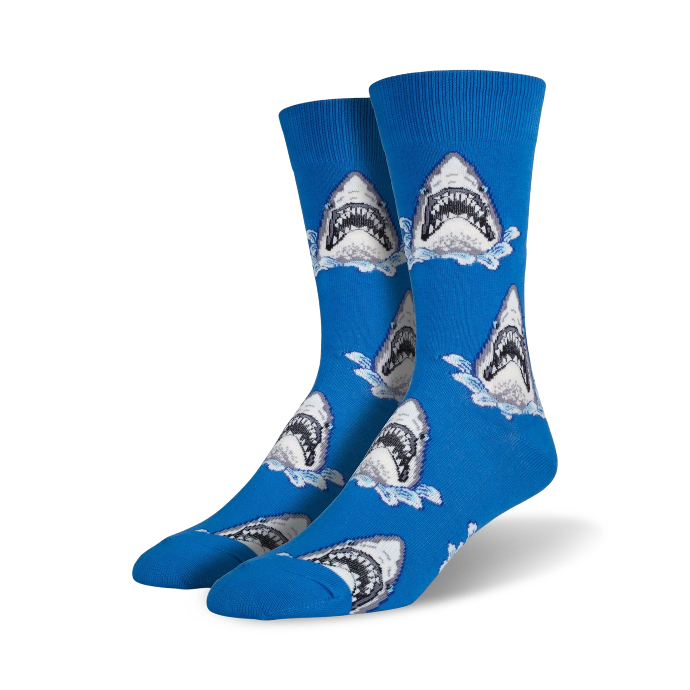Pair of crew socks in blue featuring a repeating pattern of great white shark faces breaking the water's surface.