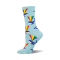 Crew socks in light blue with a pattern of whales spouting rainbows. The main colors are blue, green, yellow, orange, and red.