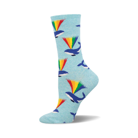 these socks have a pattern of whales. the whales are blue and have a rainbow coming out of their blowholes. socks that are blue and the pattern is repeated throughout.