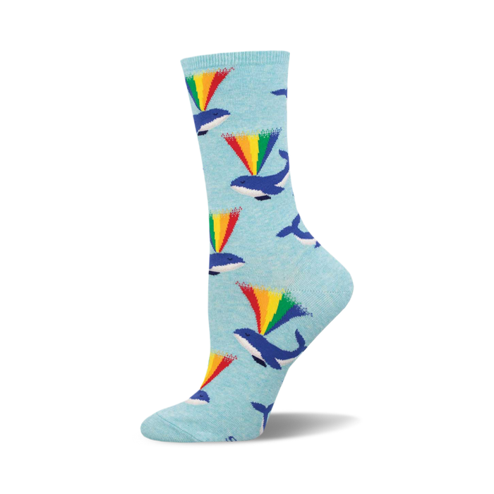 these socks have a pattern of whales. the whales are blue and have a rainbow coming out of their blowholes. socks that are blue and the pattern is repeated throughout. }}