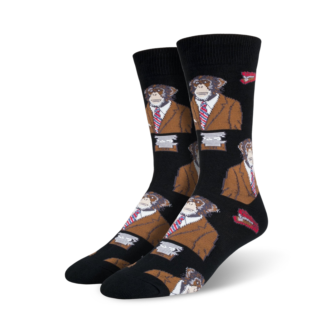 A pair of black crew socks with a repeating pattern of monkeys wearing brown suits and red ties.  Small red lips are also part of the design.