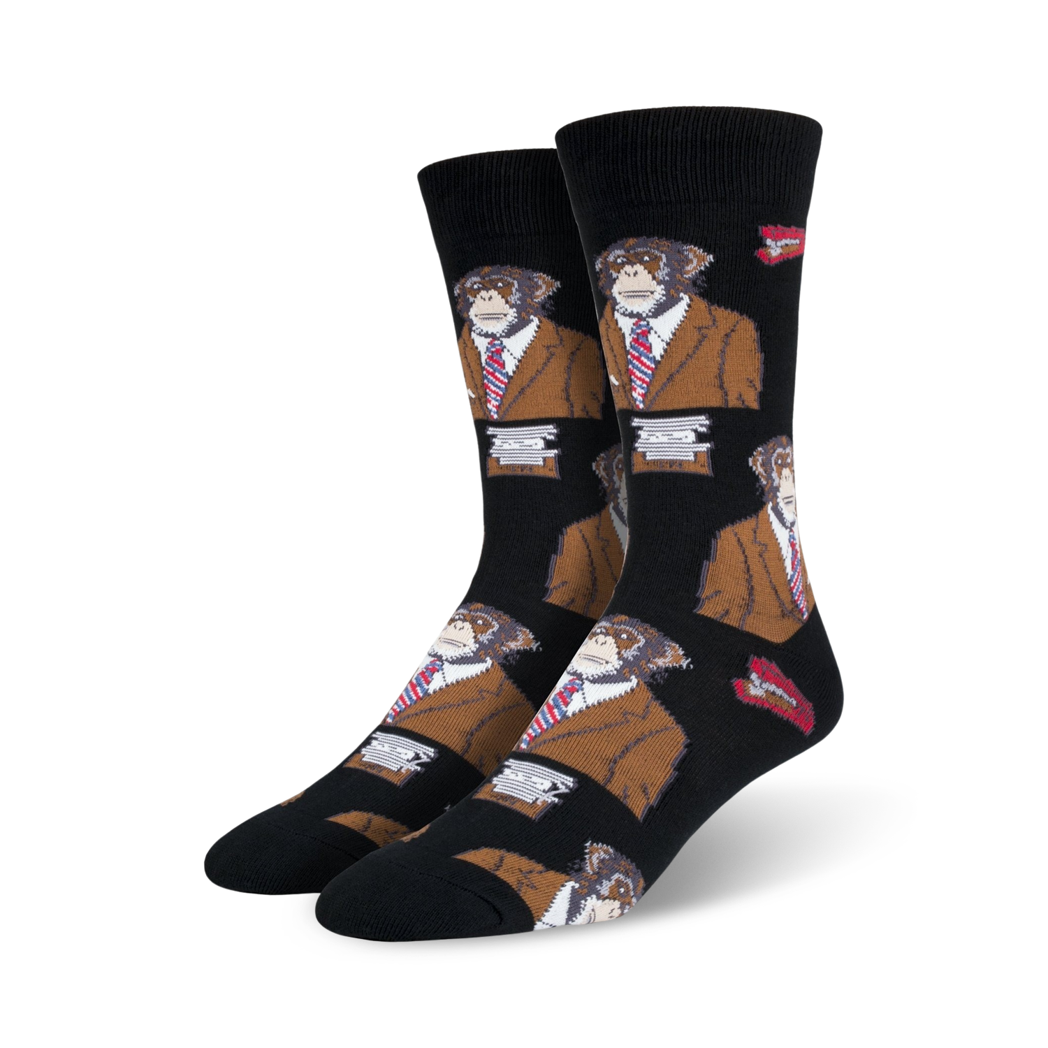 A pair of black crew socks with a repeating pattern of monkeys wearing brown suits and red ties.  Small red lips are also part of the design.