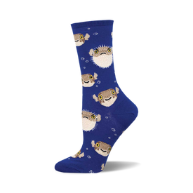 the blue socks have a pattern of pufferfish on them. the pufferfish are brown and beige with yellow eyes and black pupils. they are arranged in a repeating pattern all over the socks.