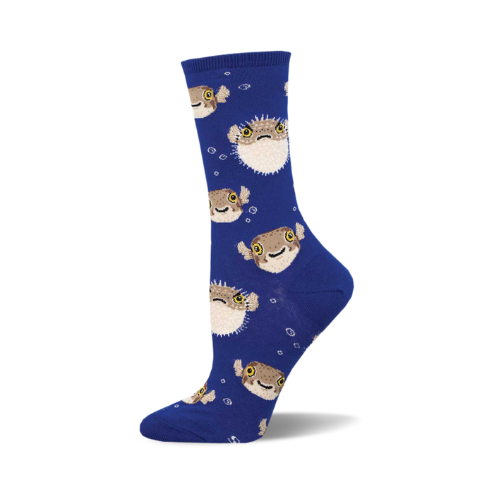 the blue socks have a pattern of pufferfish on them. the pufferfish are brown and beige with yellow eyes and black pupils. they are arranged in a repeating pattern all over the socks. }}