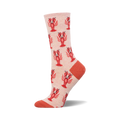 A side view of a blush pink crew sock with a repeating pattern of red cartoon lobsters. The sock's toe and heel are a coral color.