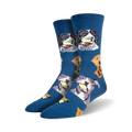 A pair of crew socks in blue featuring various dogs playfully holding tennis balls. The dogs are in shades of grey, black, and brown.