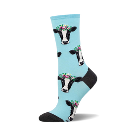 socks that are light blue and have a pattern of cows wearing flower crowns.