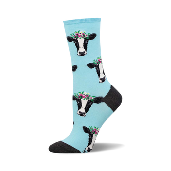 socks that are light blue and have a pattern of cows wearing flower crowns.
