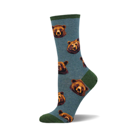 socks that are blue with a pattern of bears with brown fur and black noses. the bears are looking in different directions.