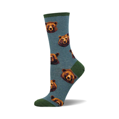 socks that are blue with a pattern of bears with brown fur and black noses. the bears are looking in different directions.