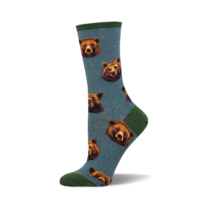 socks that are blue with a pattern of bears with brown fur and black noses. the bears are looking in different directions. }}