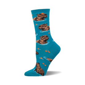 socks that are blue and have a pattern of capybaras, which are large rodents that live in south america. the capybaras are brown and white and are swimming in a blue river. there are also some small fish in the river.