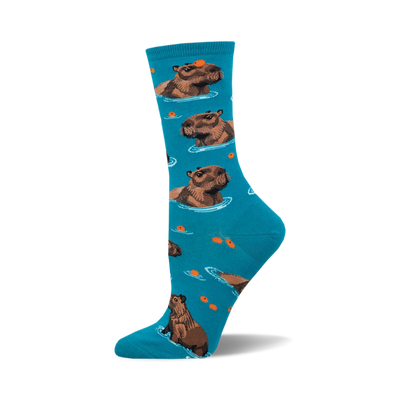 socks that are blue and have a pattern of capybaras, which are large rodents that live in south america. the capybaras are brown and white and are swimming in a blue river. there are also some small fish in the river.