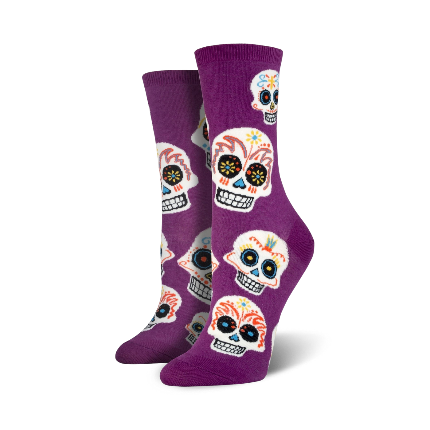 A pair of women's crew socks in purple with a fun pattern of colorful sugar skulls. Perfect for Dia de los Muertos!