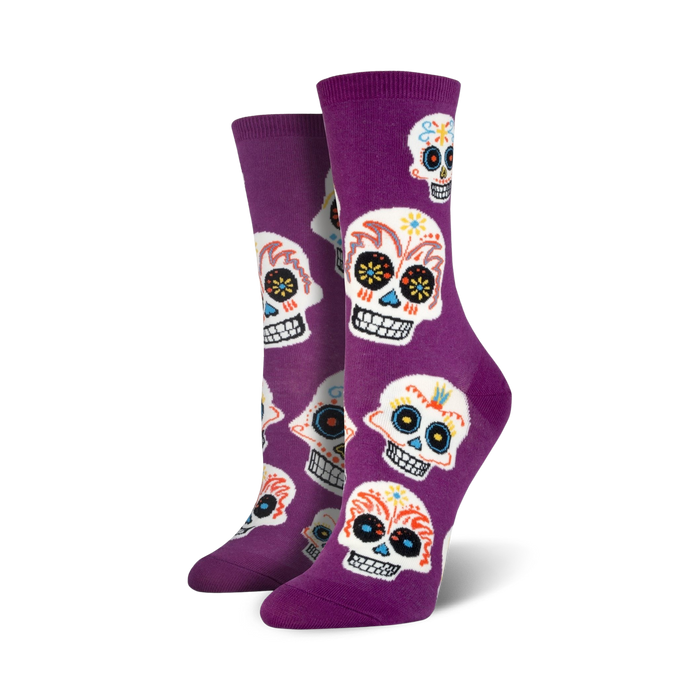 purple crew socks for women featuring a colorful multi-colored sugar skull pattern and day of the dead theme.   }}