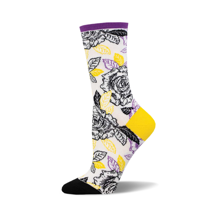 socks that are white with a pattern of black and yellow roses and green leaves. the toes and heels of socks that are black and the tops are purple. }}