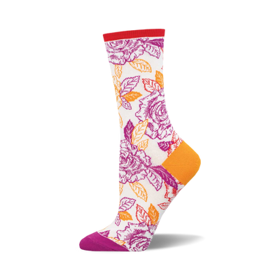 the off-white socks have a pattern of orange and purple roses with green leaves. the top of the sock is red. the heel and toe of the sock are purple.