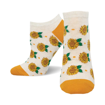 socks that are white with a pattern of sunflowers. the sunflowers are yellow with green leaves. the socks have an orange cuff.