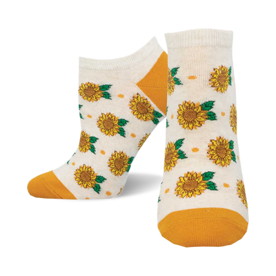 socks that are white with a pattern of sunflowers. the sunflowers are yellow with green leaves. the socks have an orange cuff.