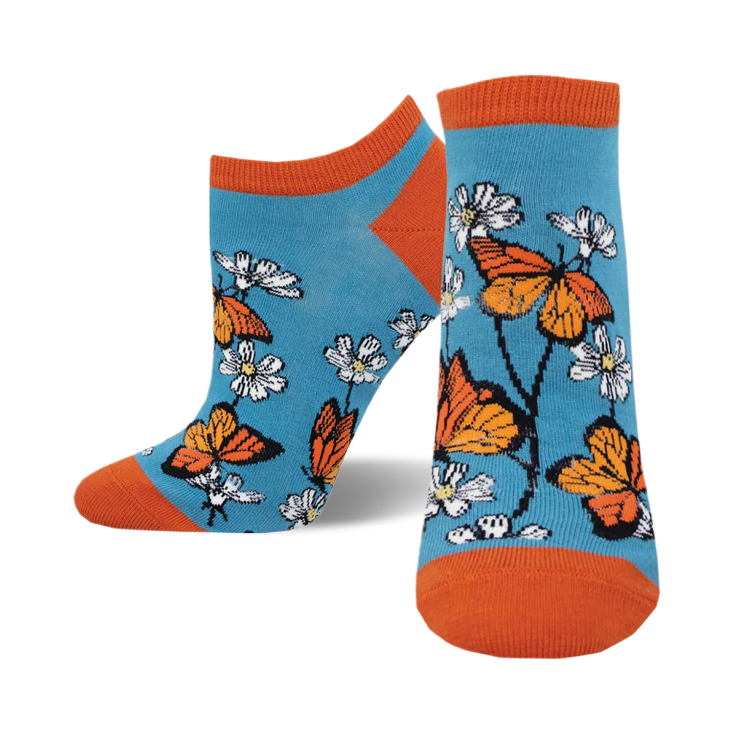 A pair of teal ankle socks adorned with orange monarch butterflies and white daisies. The socks have orange cuffs.