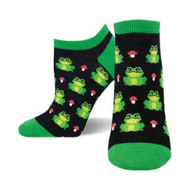 socks that are black with a pattern of green frogs and red toadstools.