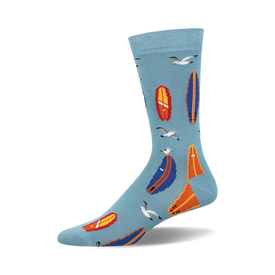 socks with a pattern of surfboards and seagulls on a blue background. the surfboards are orange, blue, and white. the seagulls are white with black eyes.