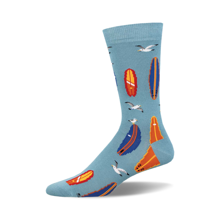 socks with a pattern of surfboards and seagulls on a blue background. the surfboards are orange, blue, and white. the seagulls are white with black eyes. }}