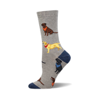 Grey crew socks with repeating images of chocolate, yellow, and black Labradors wearing bandanas.  The socks have a navy blue heel and toe.