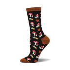 Black crew socks with red mushrooms, white flowers, and orange leaves on a dark background. Brown cuff detail. Bamboo material.