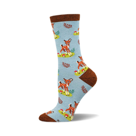 socks that are light blue with a pattern of deer, mushrooms, and leaves. the deer are brown with white spots. the mushrooms are red with white spots. the leaves are green.