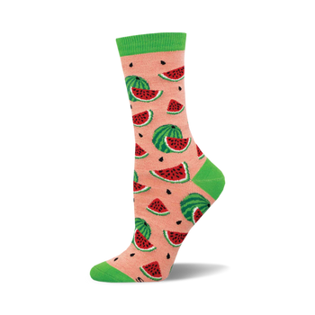 the watermelon bamboo socks are a light pink color with an all-over pattern of cartoonish watermelons with black seeds and green rinds. the top of the sock is solid light green.