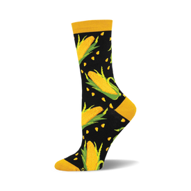 socks that are black with a pattern of yellow corn. the corn has green husks.