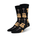 Pair of crew socks with a repeating pattern of acoustic guitars in beige and brown on a black background.