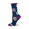 A side view of a teal crew sock adorned with a multicolored floral pattern. The sock's cuff and sole are purple, adding a pop of contrast to the design.