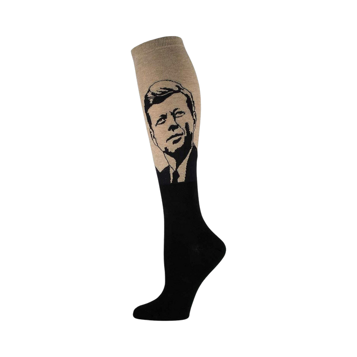Knee-high socks in beige and black, featuring a stylized black and white portrait of John F. Kennedy on the calf. }}