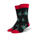 Pair of crew socks; black with red cuffs; features a repeating pattern of marijuana leaf Christmas trees with colorful ornaments.