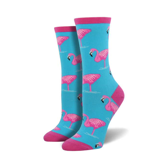  light blue crew socks with a pattern of pink flamingos standing on one leg.  