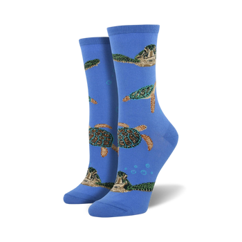 blue crew socks with a pattern of green sea turtles swimming diagonally up the sock. women's.  