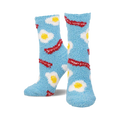 Pair of light blue fuzzy socks with a pattern of fried eggs and bacon. Crew-length, comfy and fun!